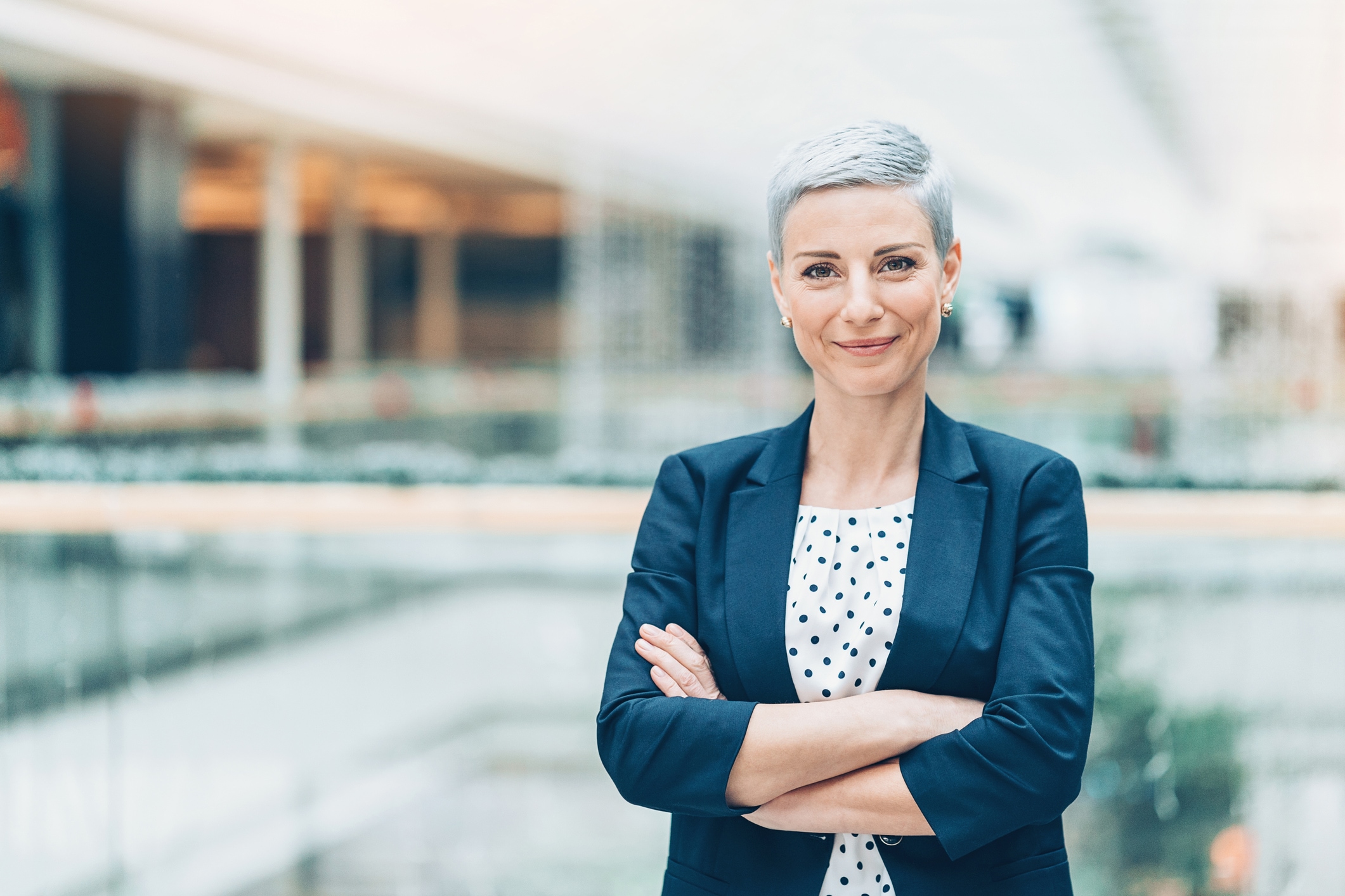 Short-haired woman with arms crossed