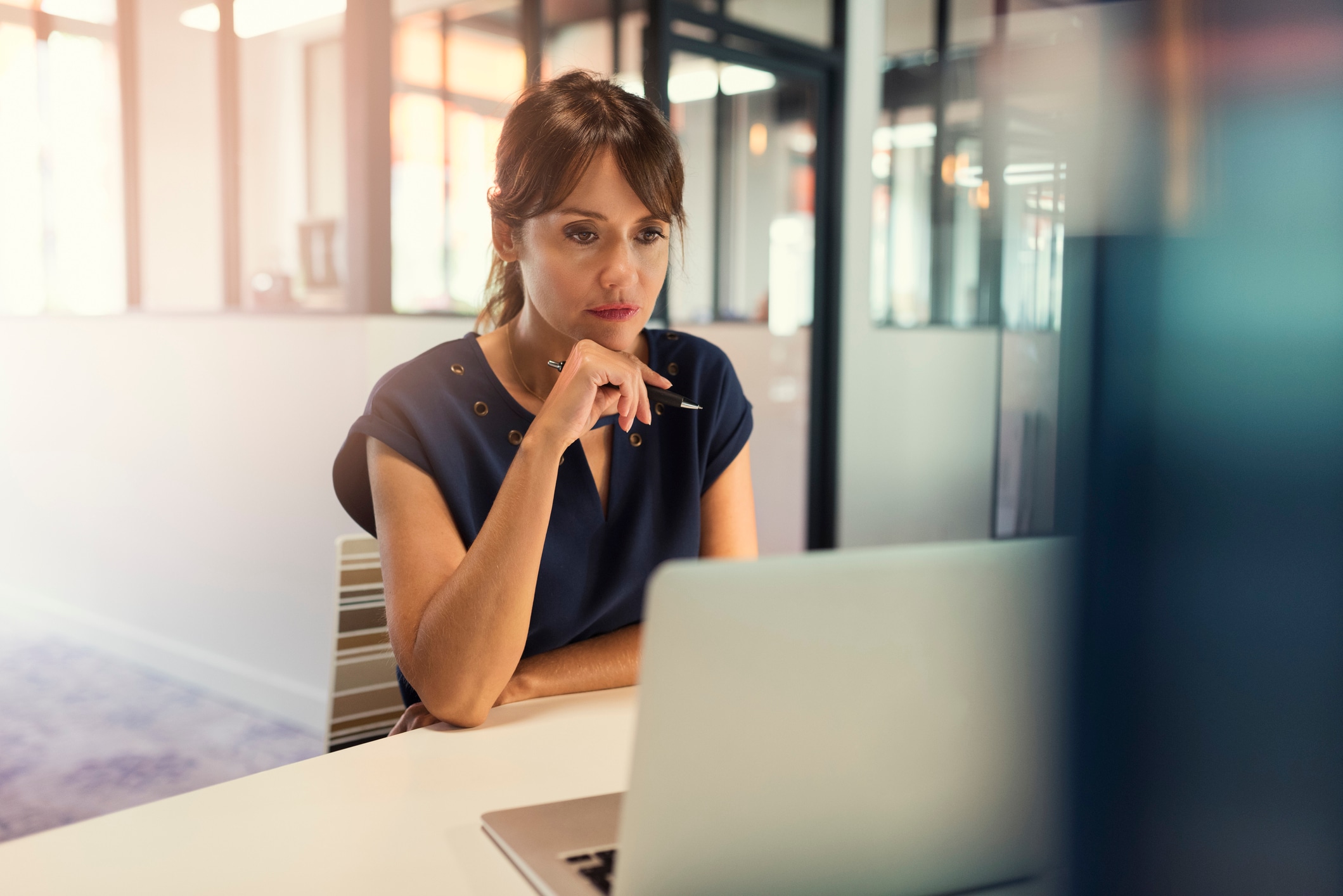 Woman looking at laptop