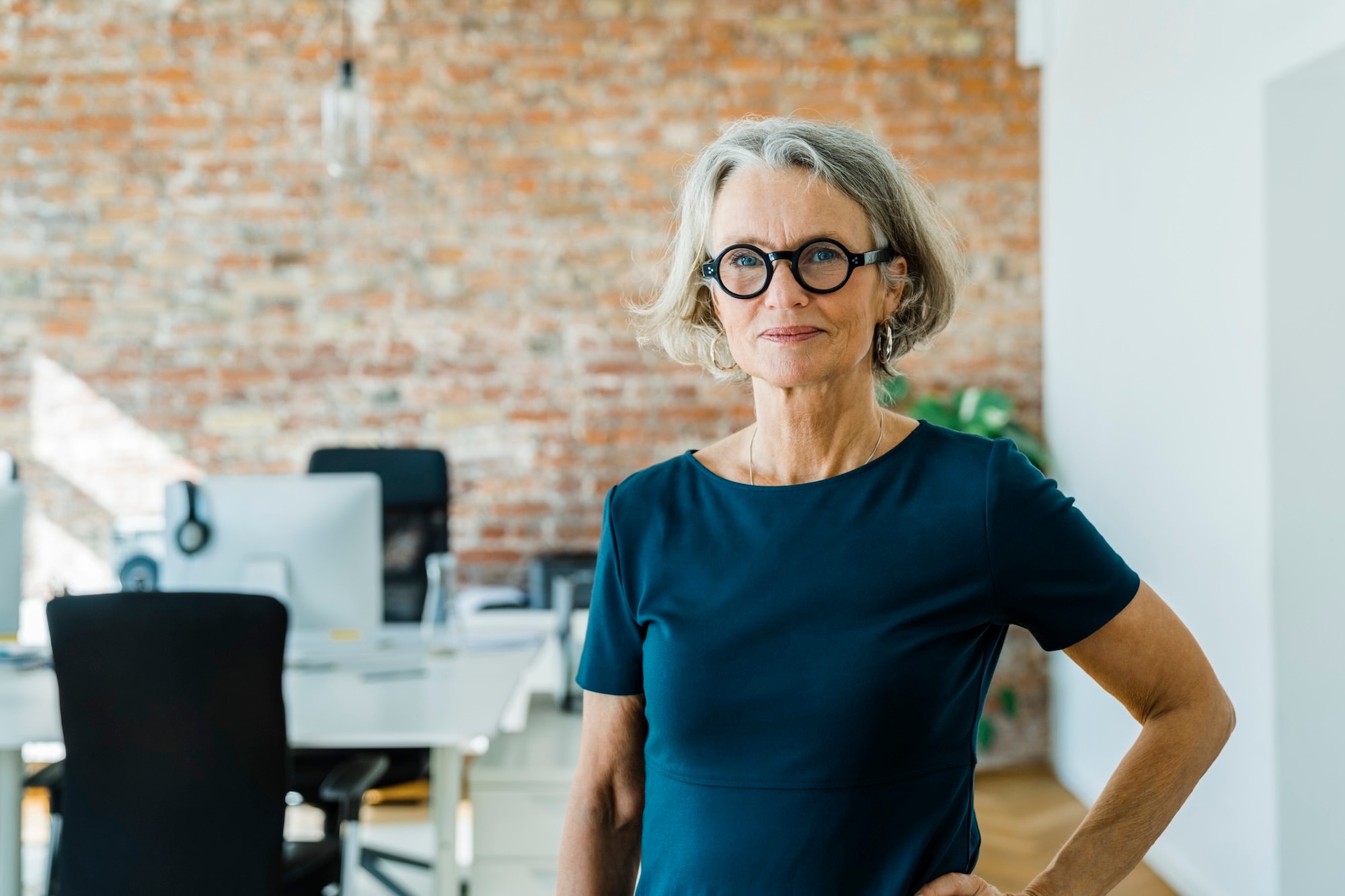 Mature woman wearing eyeglasses and looking into camera